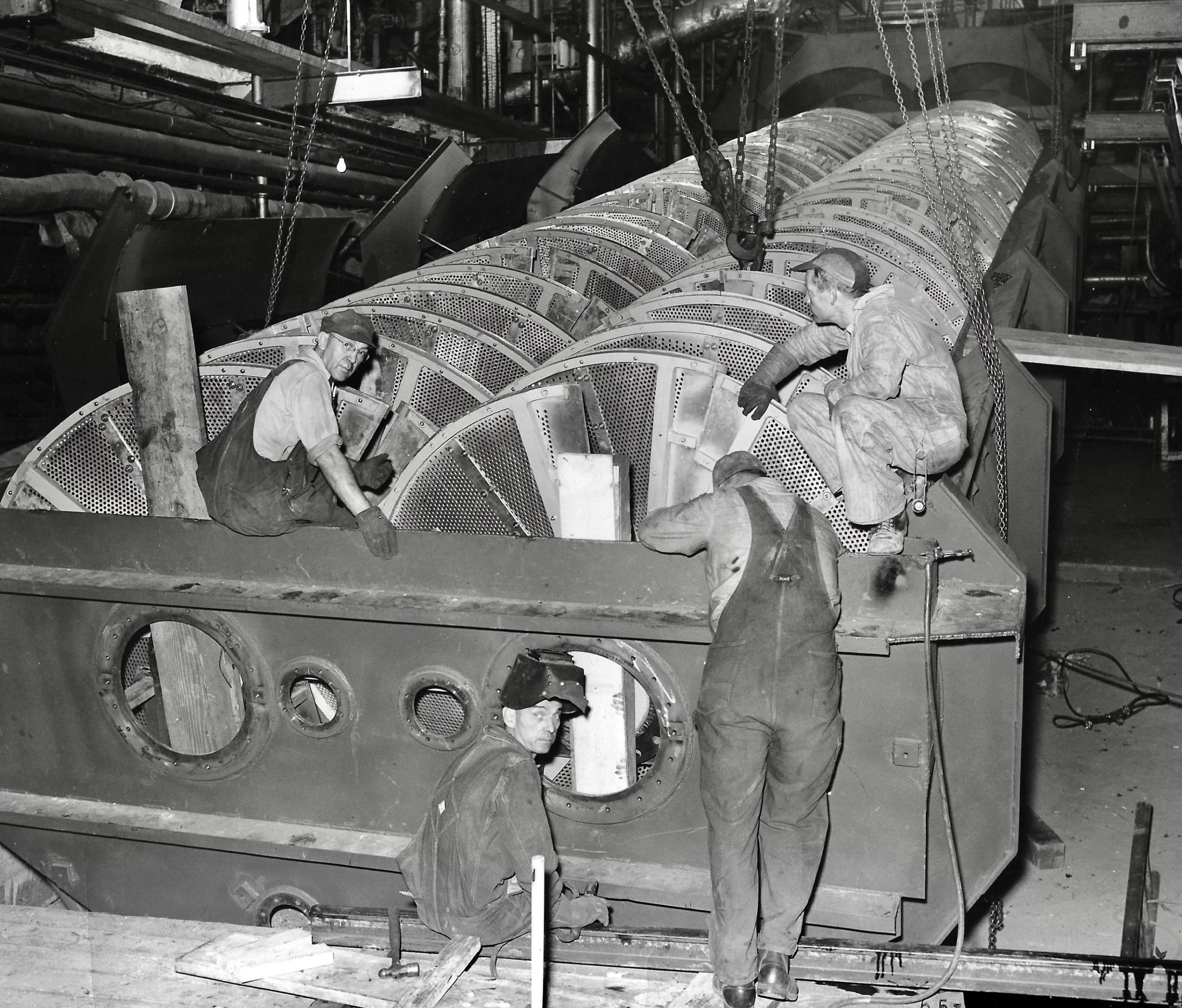 Silver Engineering machinists assembling a diffuser scroll drum in the Denver shop